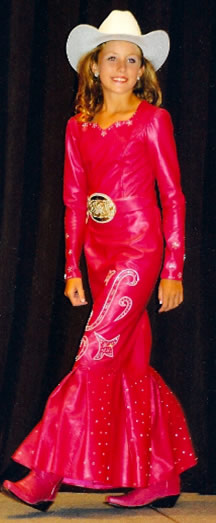 Whitney Summers wears a light coral lambskin dress