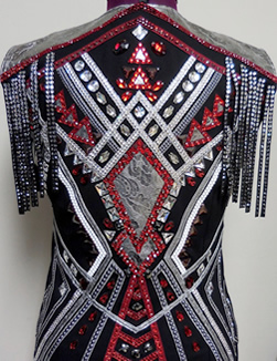 Vest trimmed with metallic leather diamonds and yolk