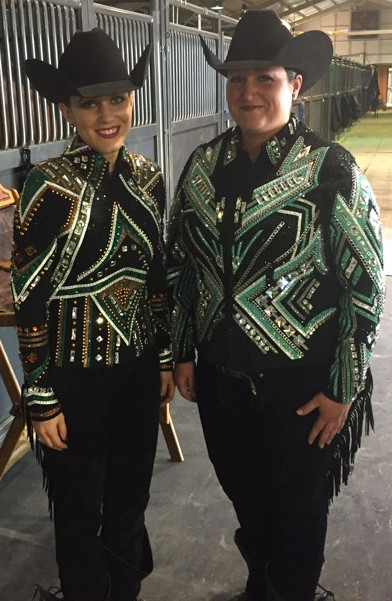 2 young women wearing metallic leather trimmed jackets